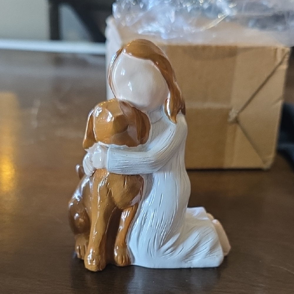 Figurine of Girl Hugging Dog